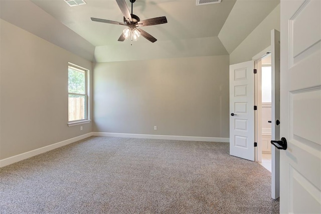 carpeted empty room with lofted ceiling and ceiling fan