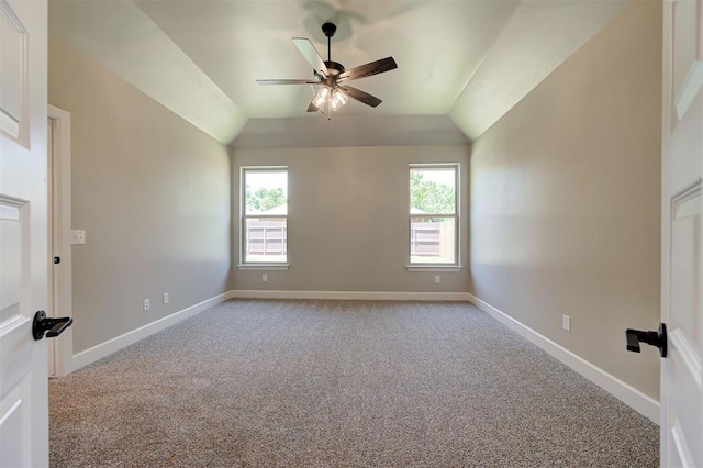 unfurnished room featuring ceiling fan, light colored carpet, and lofted ceiling