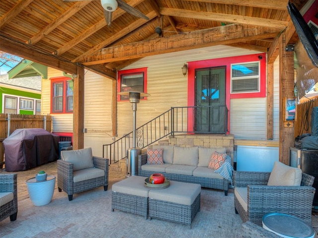 view of patio featuring outdoor lounge area, a grill, and fence