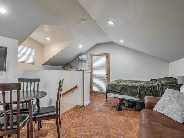 bedroom featuring lofted ceiling and recessed lighting