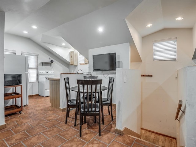 dining room with lofted ceiling, baseboards, and recessed lighting