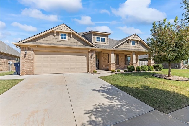 craftsman inspired home featuring a garage, covered porch, and a front yard