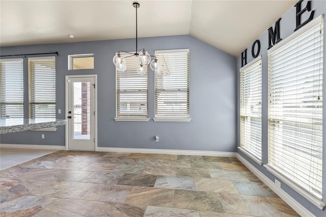 unfurnished dining area featuring vaulted ceiling and an inviting chandelier