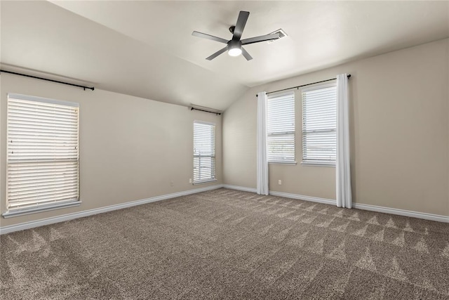 carpeted spare room with lofted ceiling and ceiling fan