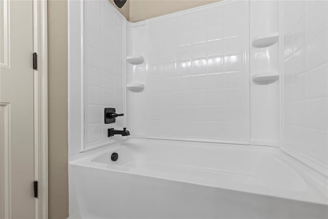 bathroom with shower / washtub combination