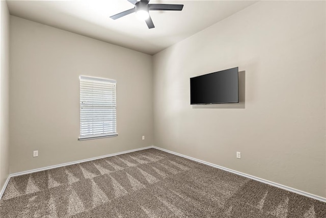 unfurnished room with ceiling fan and carpet floors