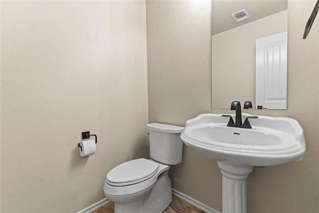 bathroom featuring toilet