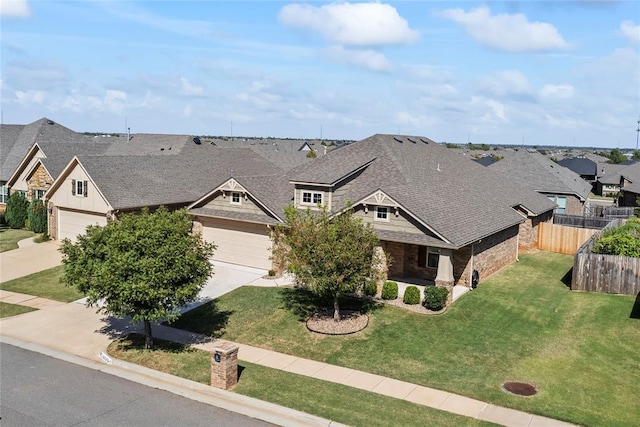 exterior space featuring a garage and a front lawn