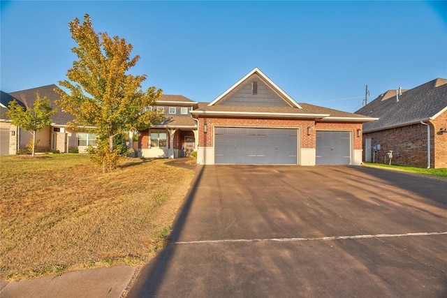 view of front facade with a garage and a front lawn