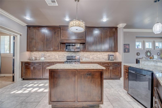 kitchen with pendant lighting, stove, dark brown cabinets, light stone counters, and a kitchen island