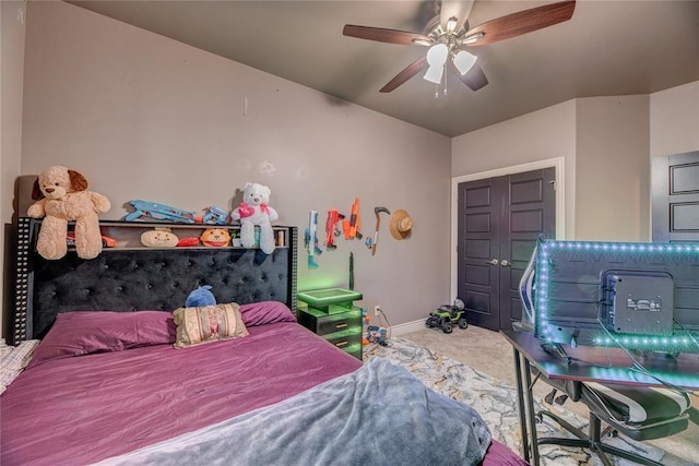 bedroom featuring ceiling fan and carpet