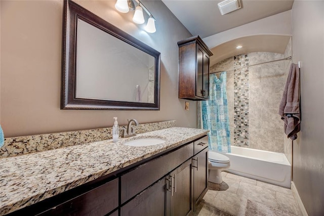 full bathroom with shower / bath combo, vanity, and toilet