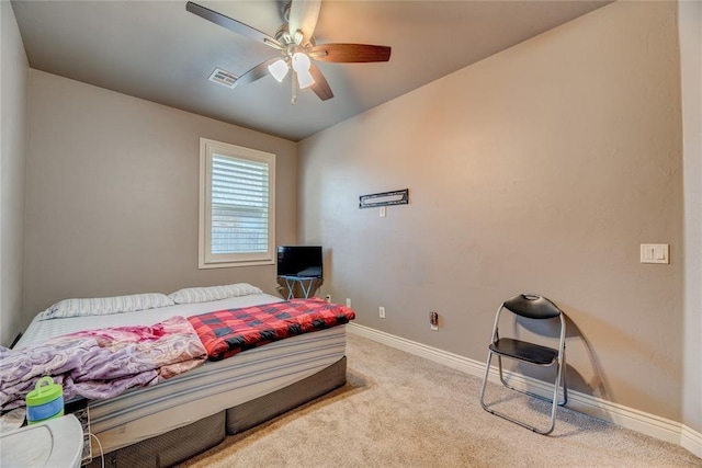 bedroom with light colored carpet and ceiling fan