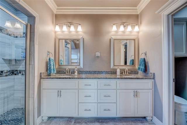 bathroom with ornamental molding, vanity, and walk in shower