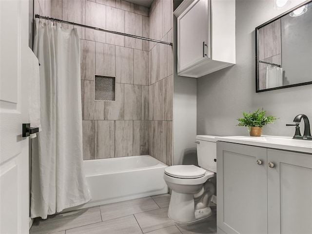 full bathroom with vanity, shower / bath combination with curtain, and toilet