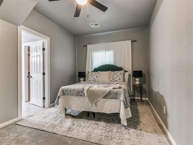 carpeted bedroom with ceiling fan