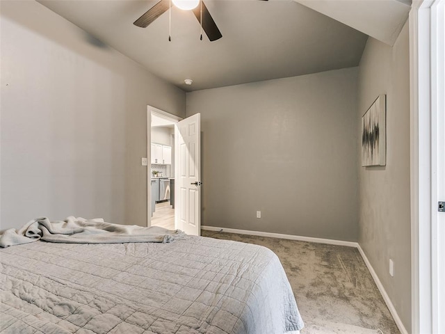 bedroom featuring light colored carpet and ceiling fan