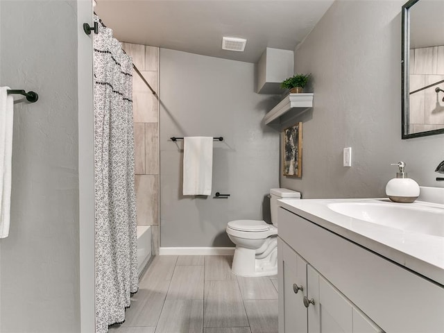 full bathroom with vanity, toilet, and shower / bath combo