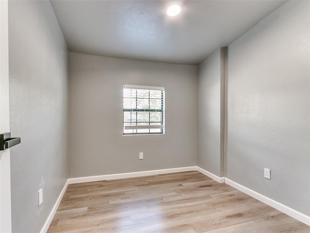 empty room with light hardwood / wood-style flooring