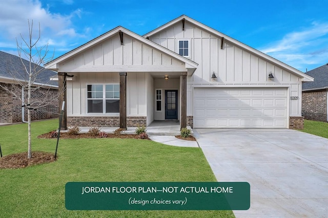 view of front of house with a garage and a front yard