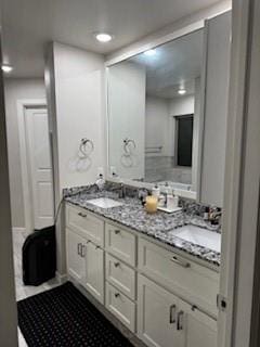 bathroom featuring double vanity and a sink