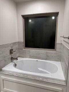 full bathroom featuring a bath