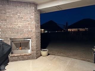 view of patio featuring a fireplace