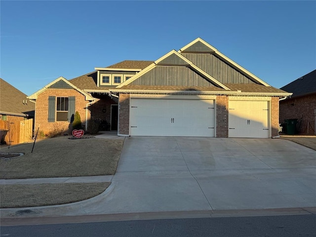 view of front facade with a garage, concrete driveway, brick siding, and board and batten siding