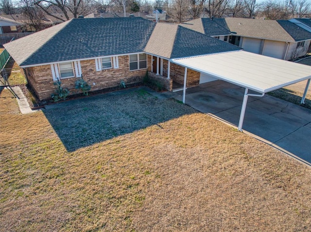 rear view of property with a lawn