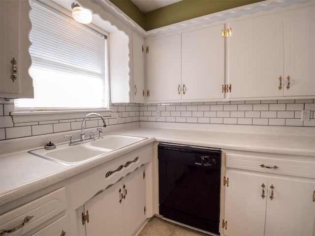 kitchen with dishwasher, sink, and white cabinets