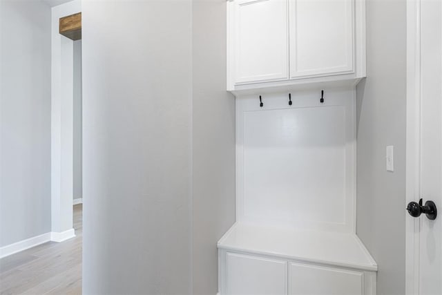 mudroom with light wood-type flooring and baseboards