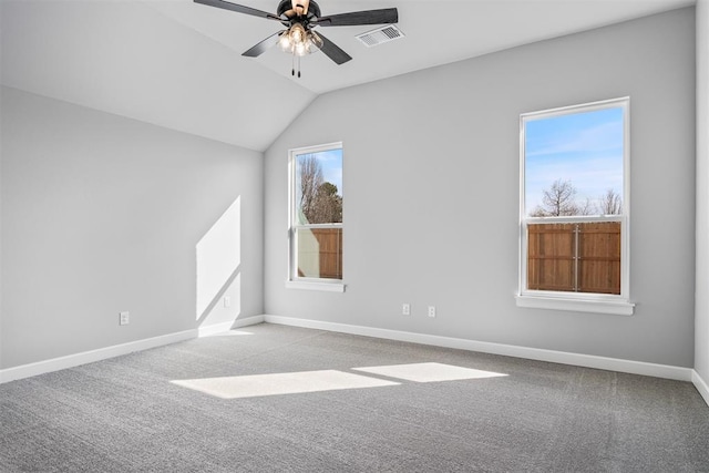 additional living space featuring lofted ceiling, visible vents, a ceiling fan, carpet flooring, and baseboards