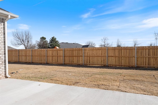 view of yard with a patio area and a fenced backyard