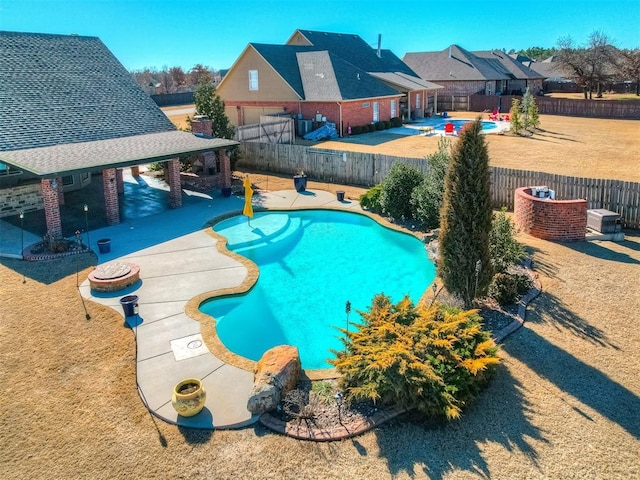 view of swimming pool with a patio area