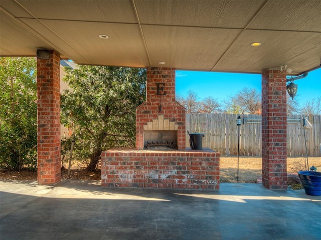 view of patio / terrace with an outdoor brick fireplace