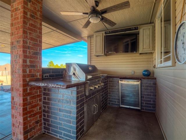 view of patio with exterior kitchen, area for grilling, and a ceiling fan