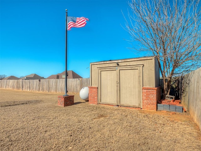 view of shed featuring a fenced backyard