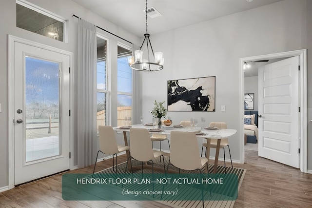 dining area with hardwood / wood-style flooring