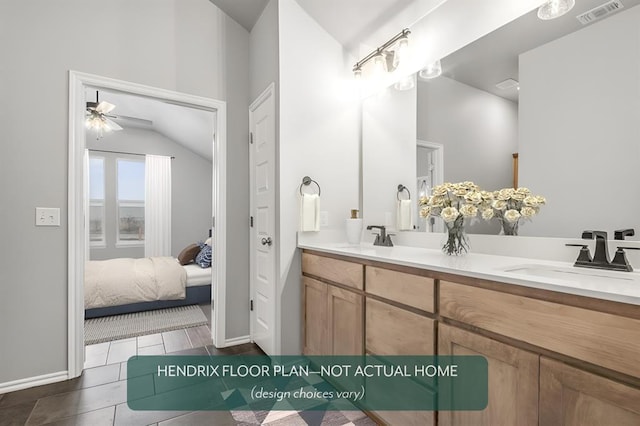 bathroom featuring ceiling fan, vanity, tile patterned flooring, and lofted ceiling