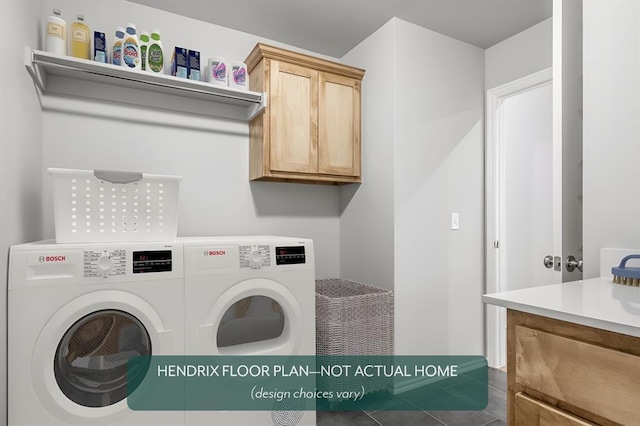 laundry room with cabinets and washing machine and dryer