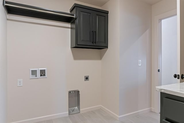 13325 SW 8th St, Yukon, OK 73099 - laundry room featuring cabinet space, electric dryer hookup, baseboards, and washer hookup