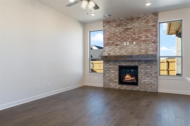 13325 SW 8th St, Yukon, OK 73099 - unfurnished living room with visible vents, a ceiling fan, baseboards, and a healthy amount of sunlight