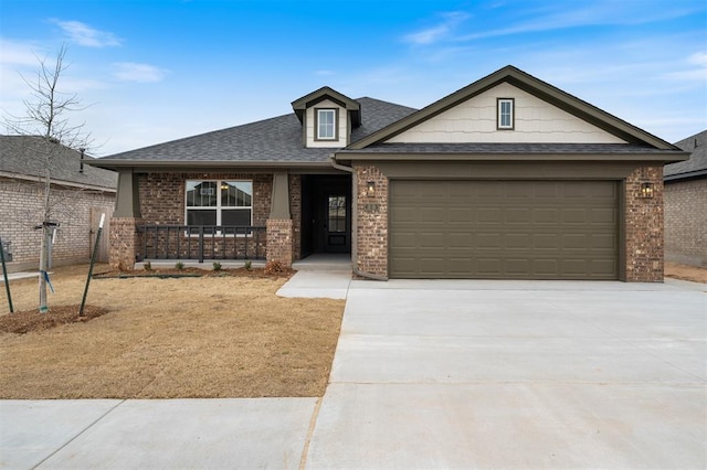 view of front of house featuring brick siding, a porch, concrete driveway, roof with shingles, and an attached garage