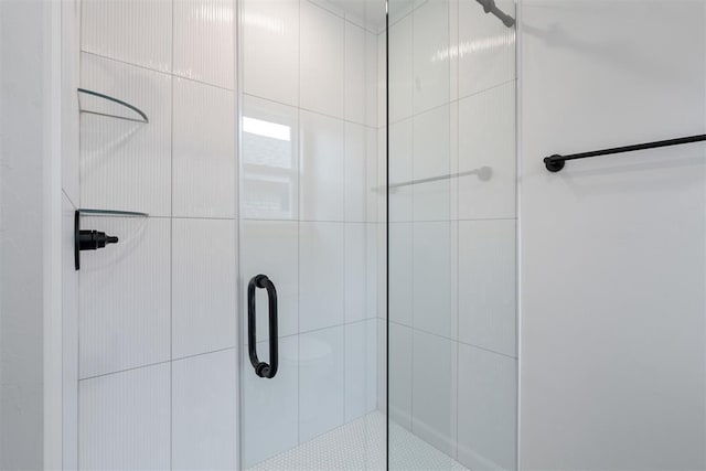 full bath featuring a shower stall