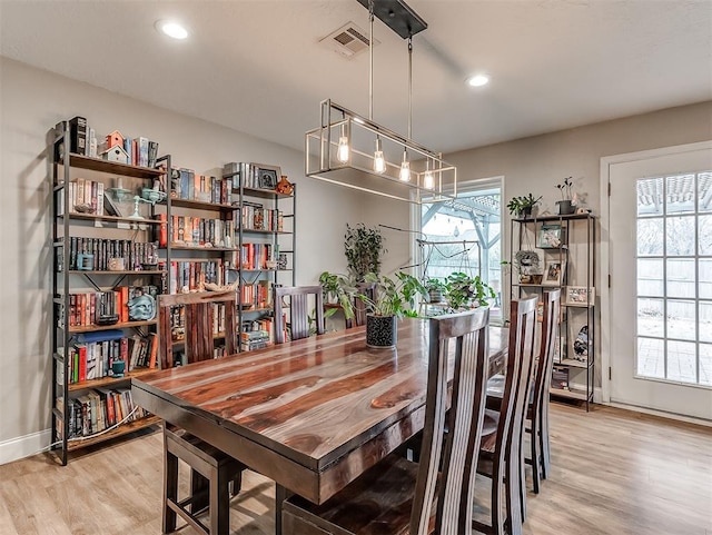 dining space featuring light hardwood / wood-style floors