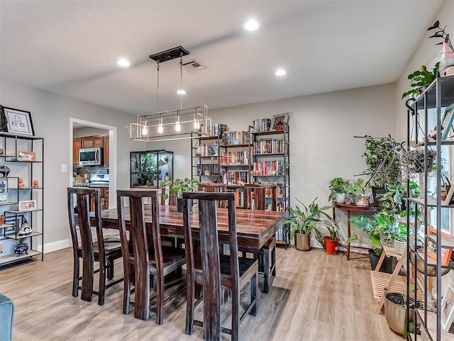 dining room featuring light hardwood / wood-style flooring