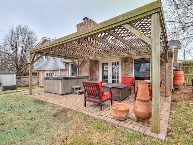 view of patio featuring french doors, a hot tub, and a pergola