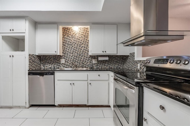 kitchen with stainless steel appliances, sink, island range hood, and white cabinets