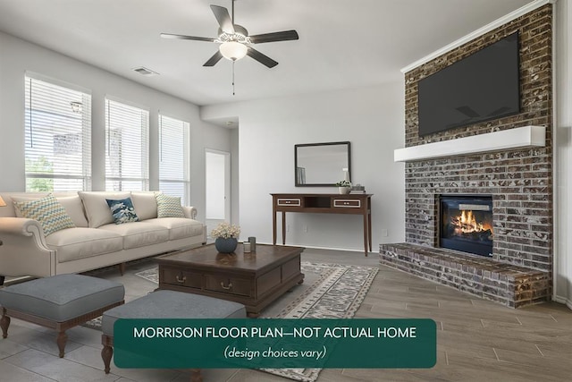 living room featuring hardwood / wood-style flooring, ceiling fan, and a fireplace