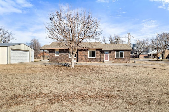 view of front of home with an outbuilding and a garage